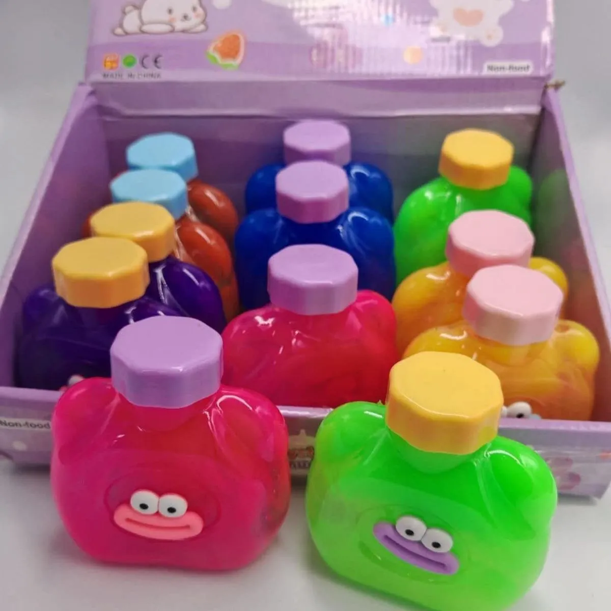 Zabawki Slime Crystal Mud w butelkach buźki 12 szt.