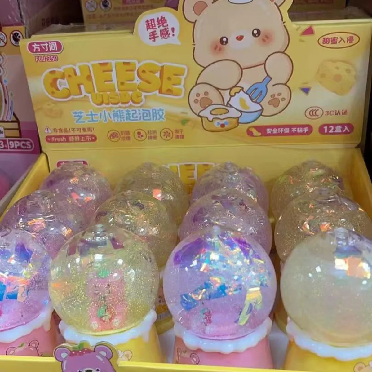 Zabawki Slime Cheese w kuli brokatowej, 12 szt