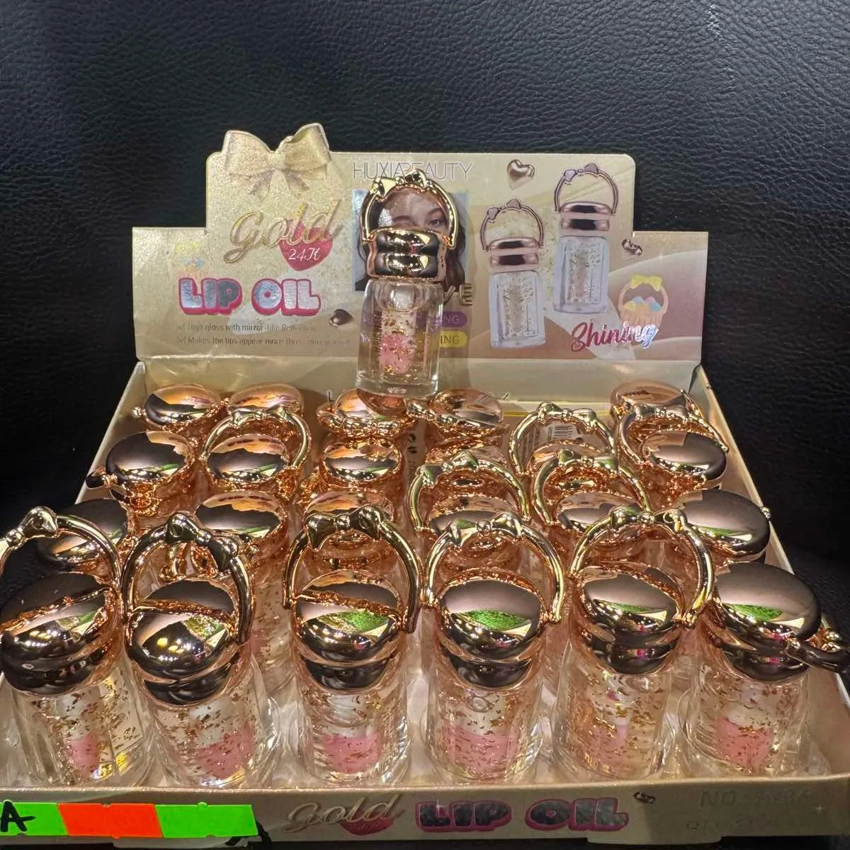 Lip Oil Gold 24K błyszczyk do ust w złotym opakowaniu
