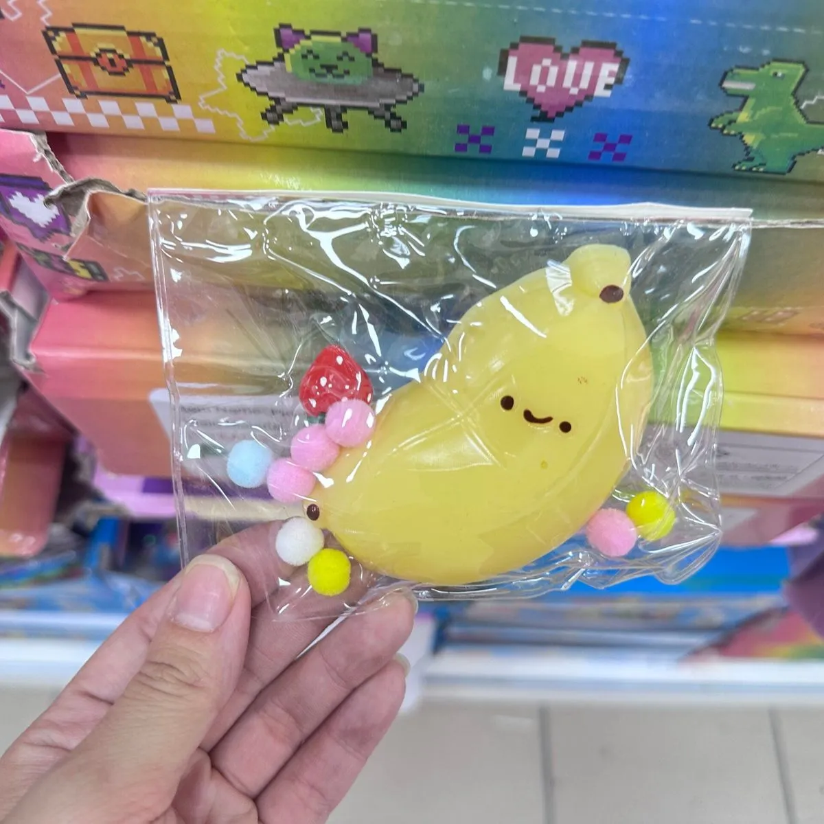 Zabawki Squeeze Toys Gniotek Banan z Pomponami 16 szt