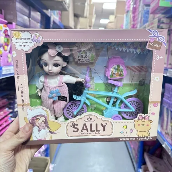 Lalka Sally z rowerkiem i akcesoriami, różowy kombinezon