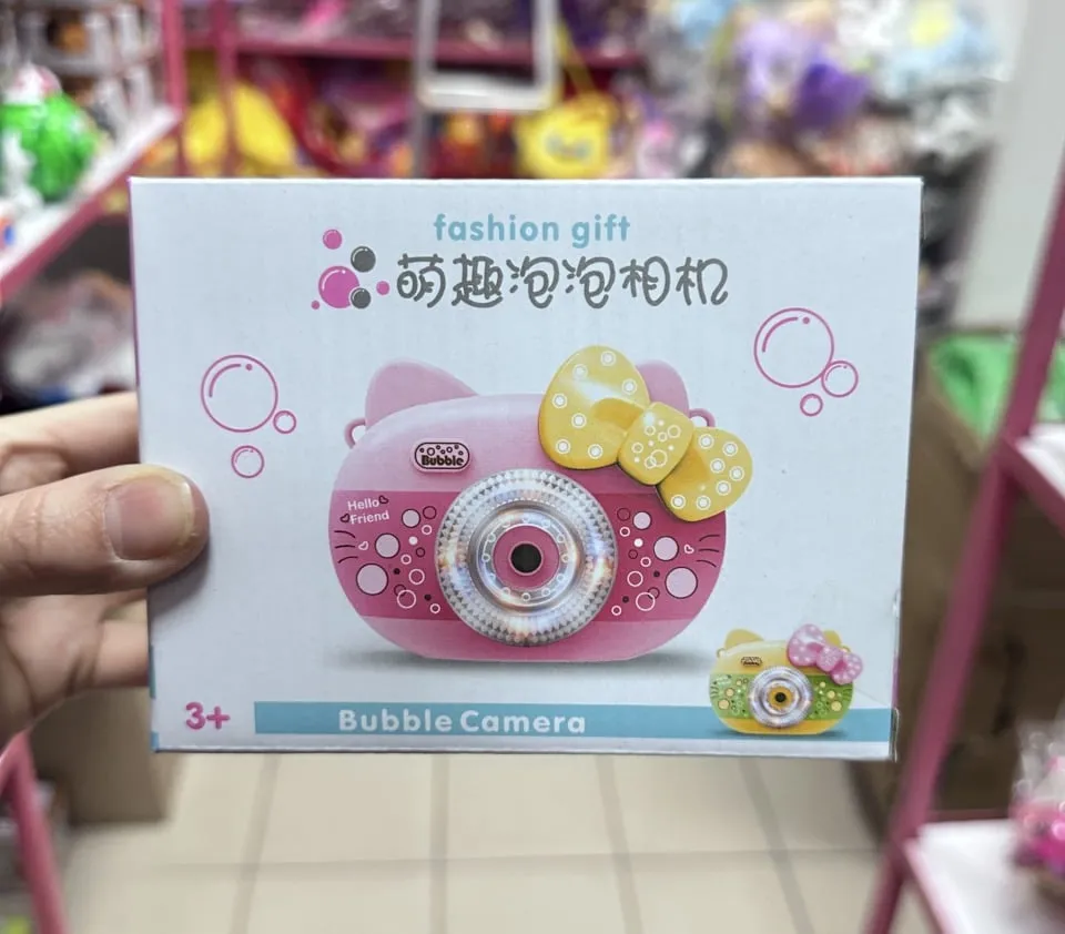 Aparat na bańki mydlane Bubble Camera różowy z żółtą kokardką