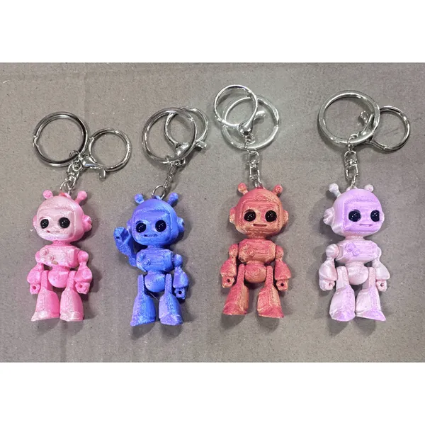 Brelok robot figurka 3D ruchome kończyny mix kolorów 24szt