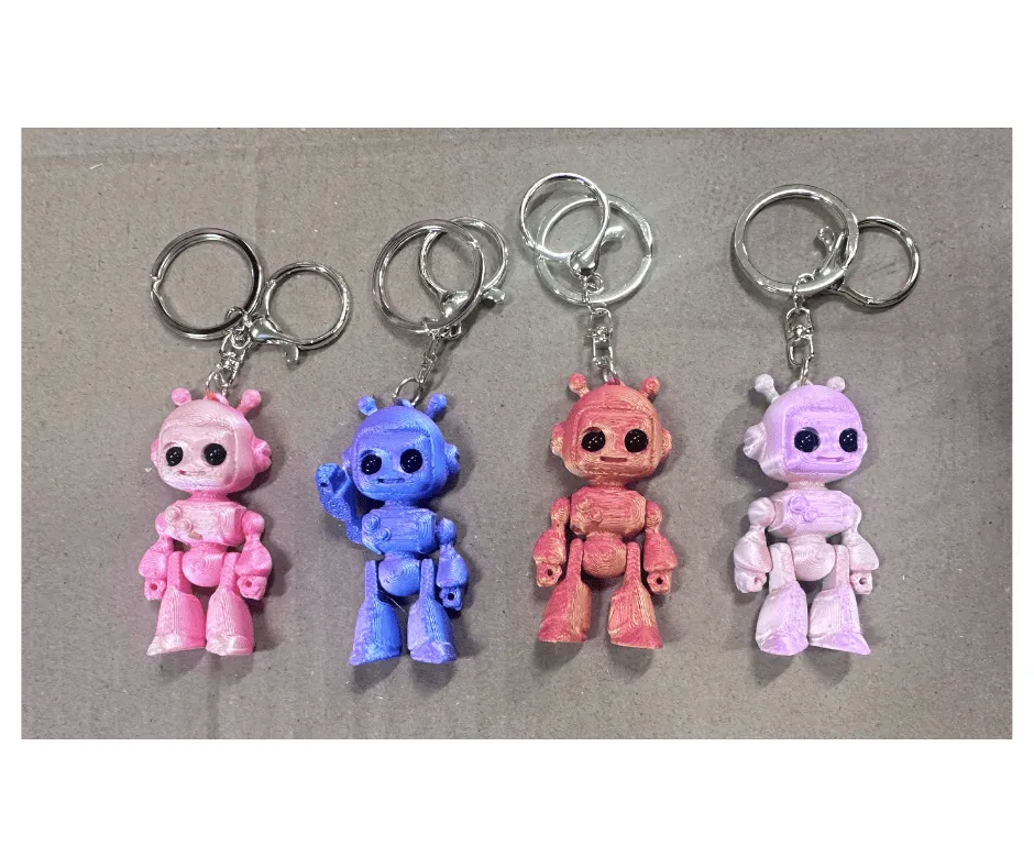 Brelok robot figurka 3D ruchome kończyny mix kolorów 24szt
