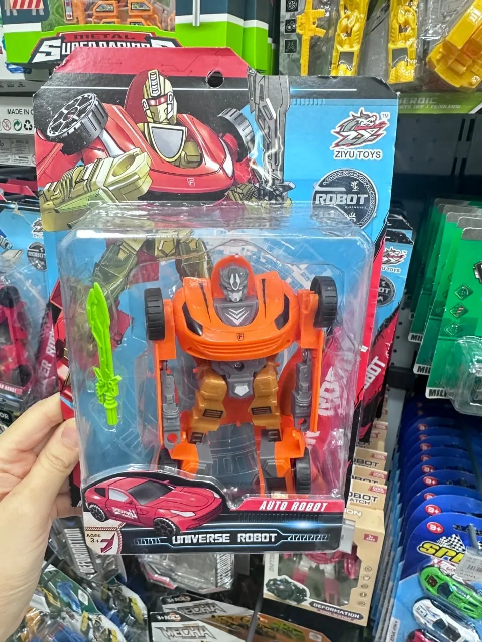 Robot transformujący ZIYU TOYS pomarańczowy z mieczem PK13394