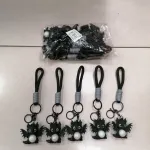 Brelok smok czarny z białą kulką i szarym uchwytem