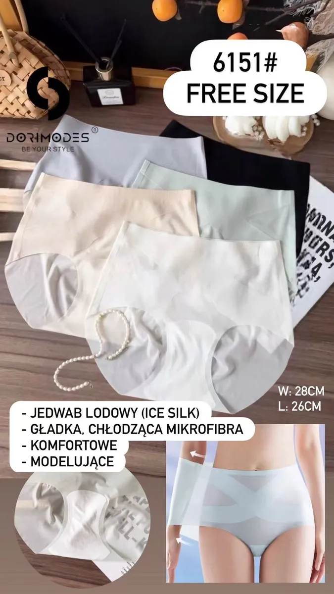 Majtki damskie modelujące w czterech kolorach: beżowym, białym, jasnoszarym i czarnym, ułożone na stole