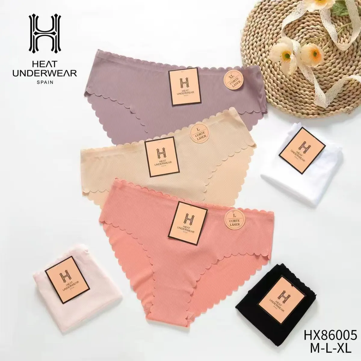 Zestaw trzech bezszwowych fig w pastelowych kolorach z laserowo wyciętymi brzegami i logo Heat Underwear