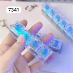 Brelok LED z przezroczystymi kostkami i niebieskim światłem