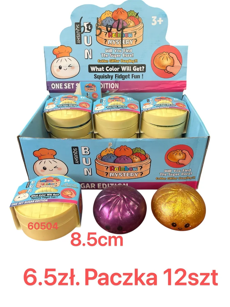 zabawka squishy w kształcie bułeczki w kolorze fioletowym i złotym z brokatem, opakowanie zbiorcze