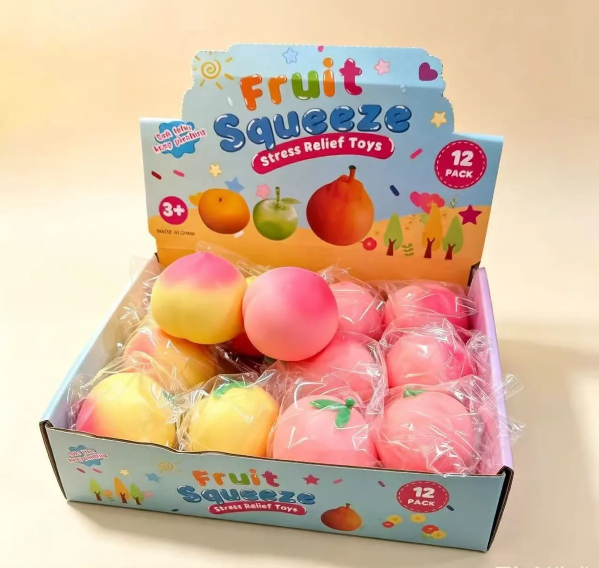 Zestaw 12 zabawek antystresowych Fruit Squeeze w kształcie brzoskwiń w kartonowym displayu