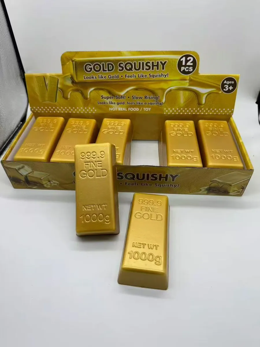 Złote squishy w kształcie sztabek złota 999.9 Fine Gold 1000g w złotym displayu zawierającym 12 sztuk