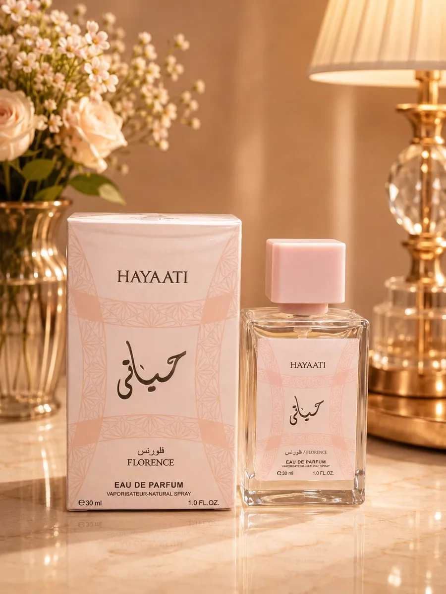 Perfumy Hayaati Florence 30ml w szklanym flakonie z różowym wieczkiem obok ozdobnego pudełka