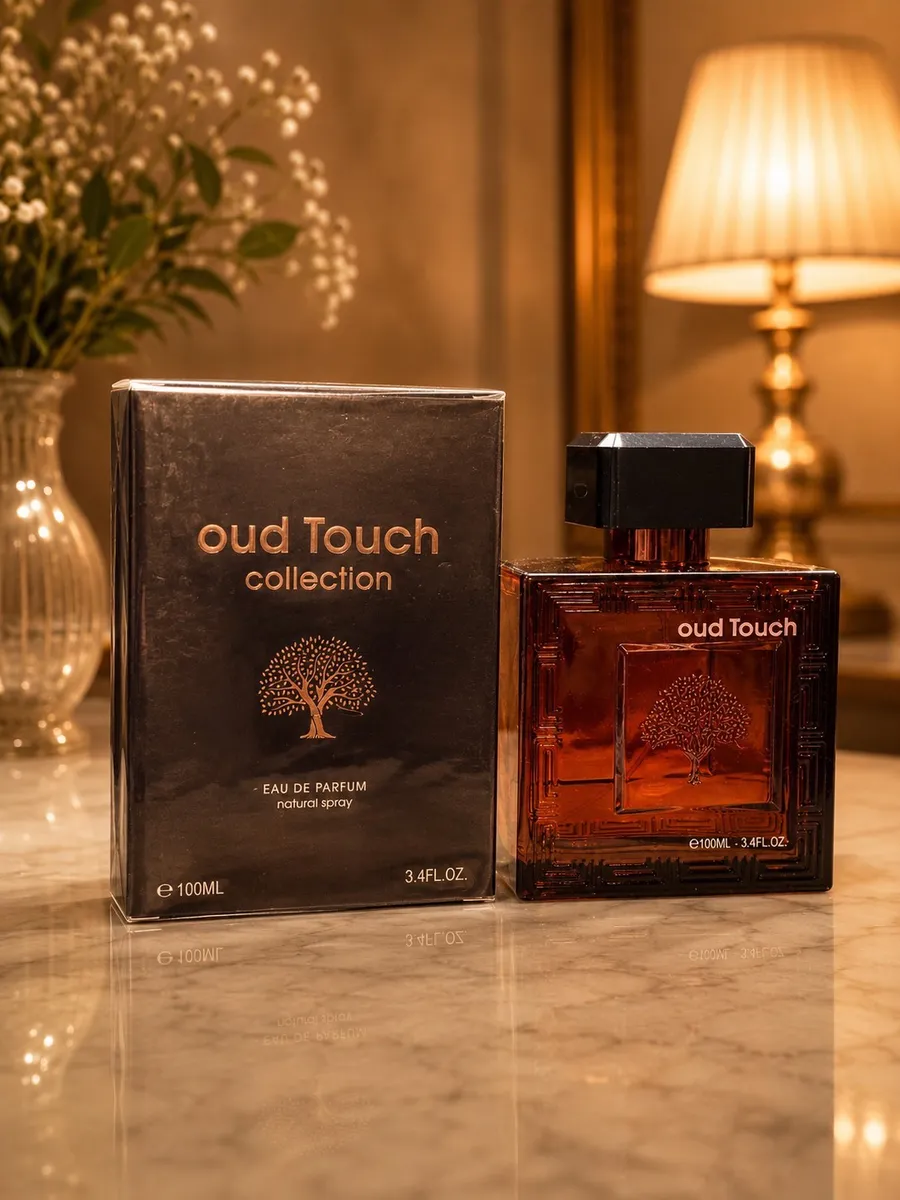 Perfumy Oud Touch Collection 100ml w bursztynowej butelce z czarną nakrętką i czarne opakowanie