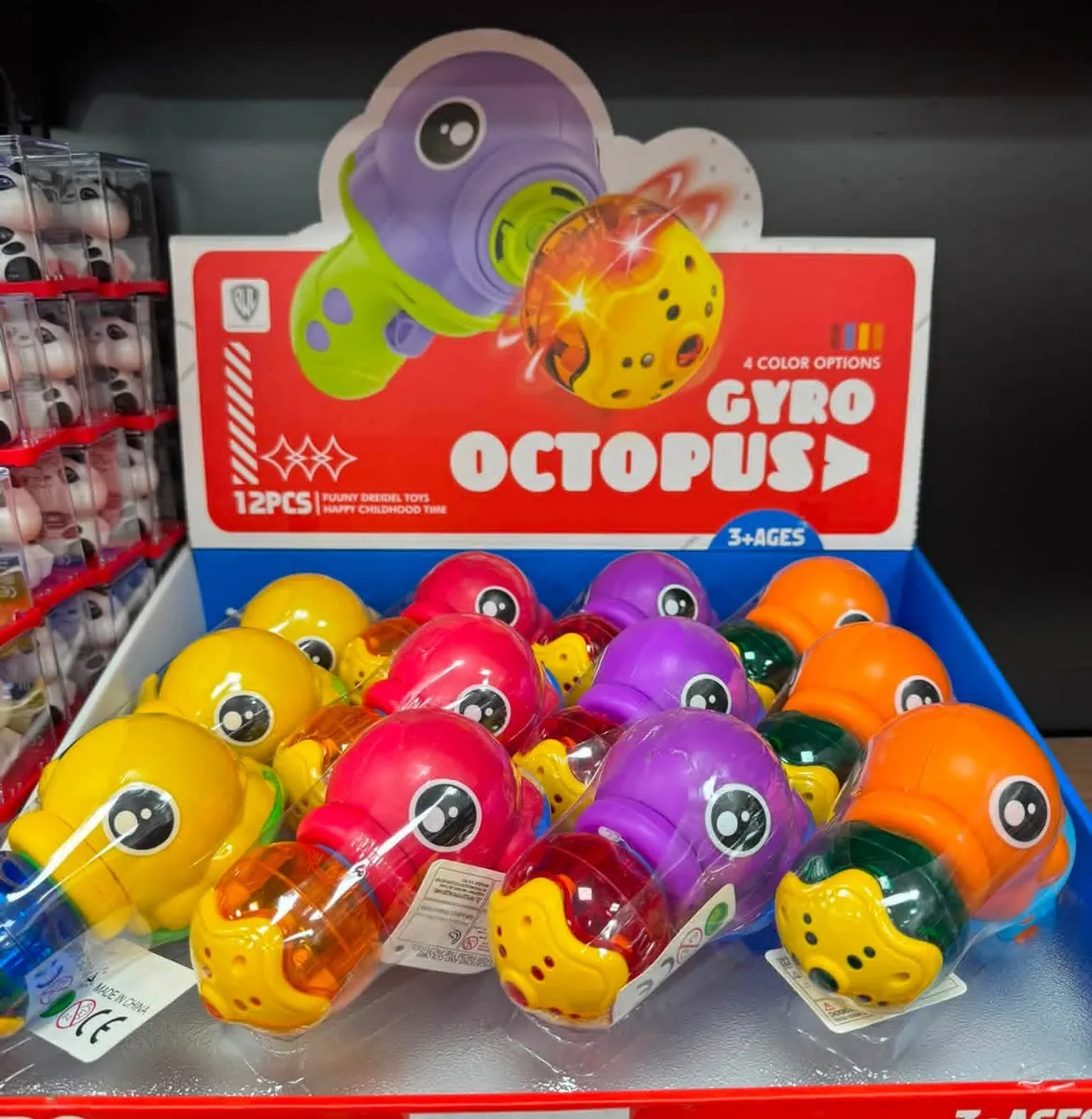 Zabawki Gyro Octopus w czterech kolorach z wirującą kulą w opakowaniu zbiorczym