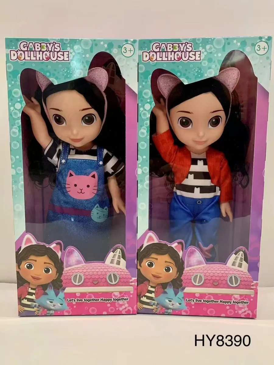 Dwie lalki Gabby's Dollhouse w kolorowych ubraniach z opaskami z uszami kota w oryginalnych pudełkach