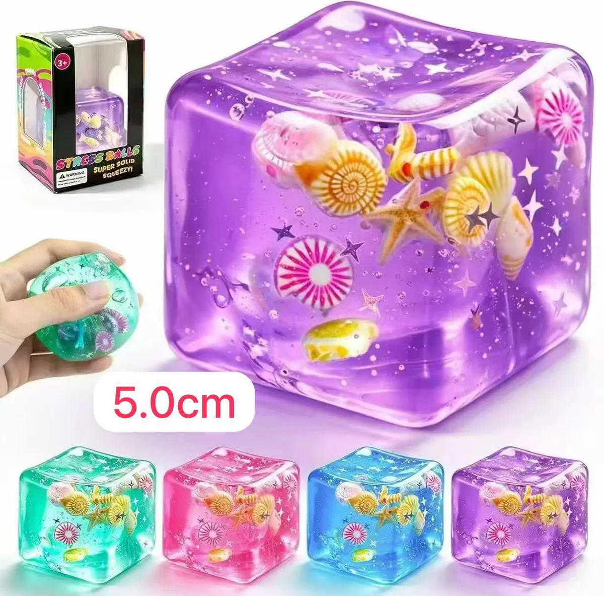 Kolorowa przezroczysta kostka squeeze toy z zatopionymi muszelkami i gwiazdkami 5 cm