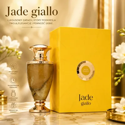 Butelka perfum Jade Giallo z marmurowym wzorem i żółte eleganckie opakowanie na stole z kwiatami