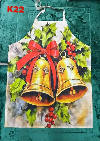 Fartuch kuchenny z motywem złotych dzwonków, czerwonej kokardy i gałązek ostrokrzewu na jasnym tle