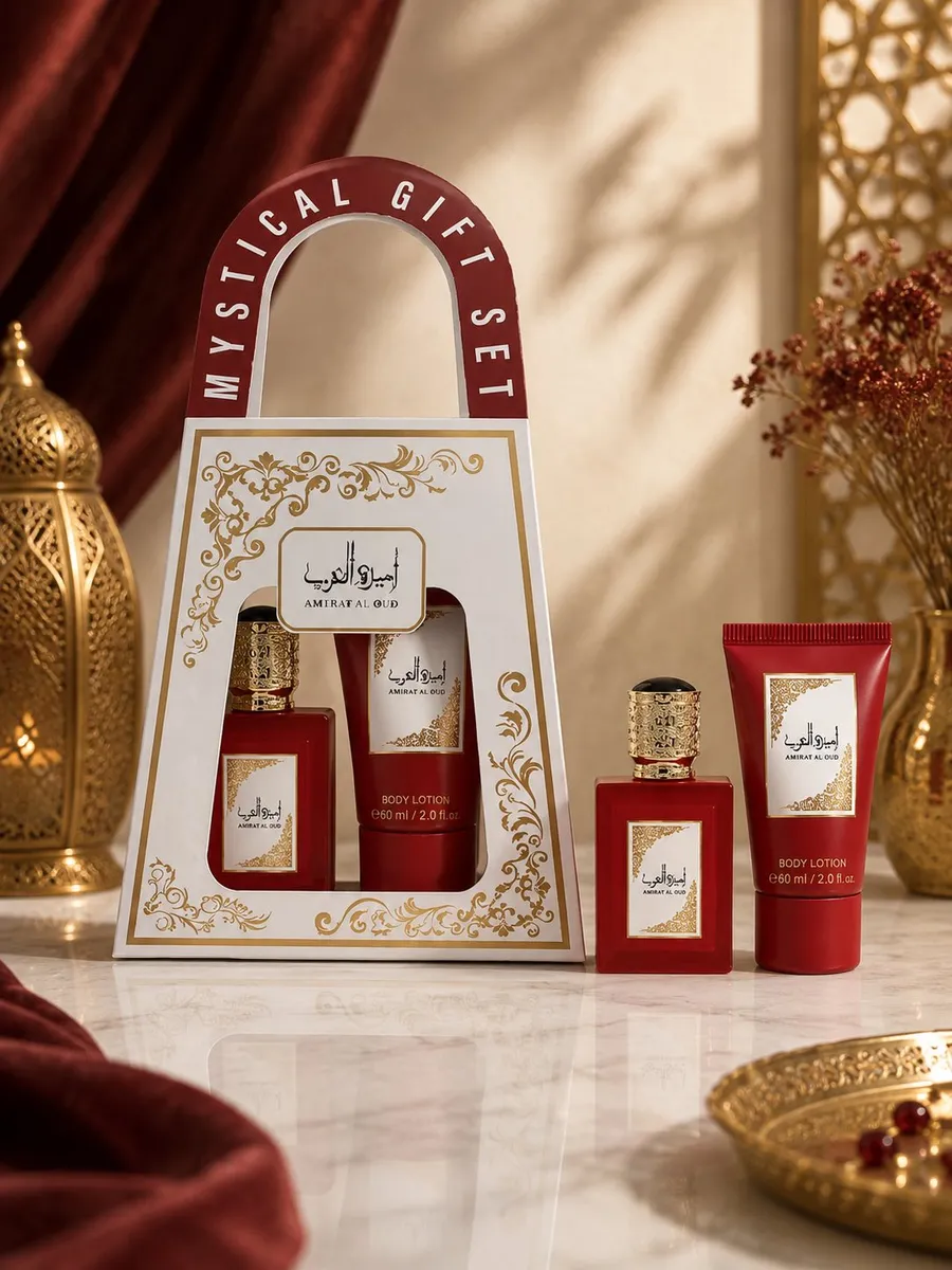 Zestaw prezentowy perfumy i balsam w czerwonym opakowaniu z złotymi zdobieniami na marmurowym blacie