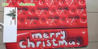 Czerwona mata podłogowa z napisem merry christmas i białymi kokardkami 48x78 cm