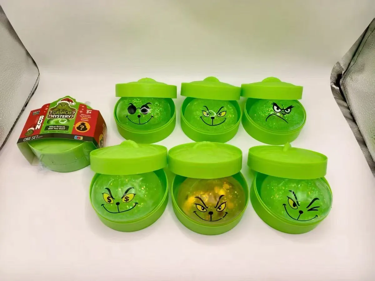 Zielony slime z twarzą Grincha w pojemniku 7 wzorów