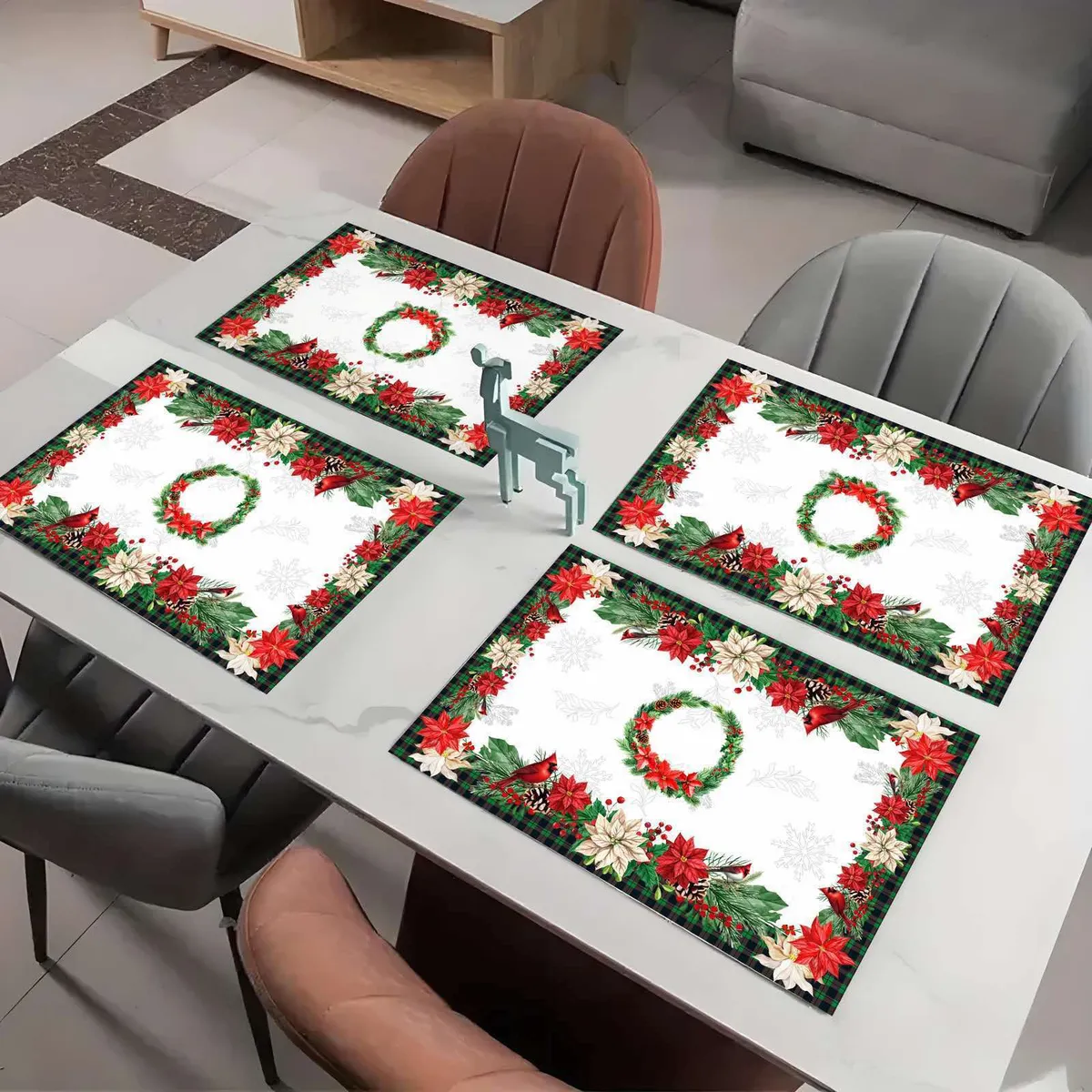 Cztery świąteczne serwetki 30x45 cm z czerwonymi i białymi gwiazdami betlejemskimi oraz zielonym wieńcem na białym tle