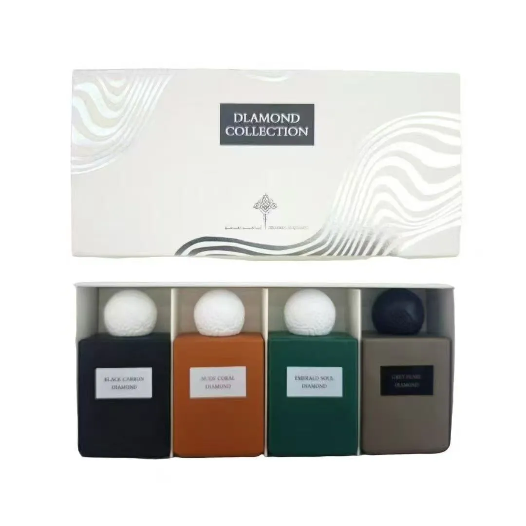 Zestaw czterech perfum w kolorowych butelkach z korkami imitującymi piłkę golfową w jasnym pudełku z napisem Diamond Collecti