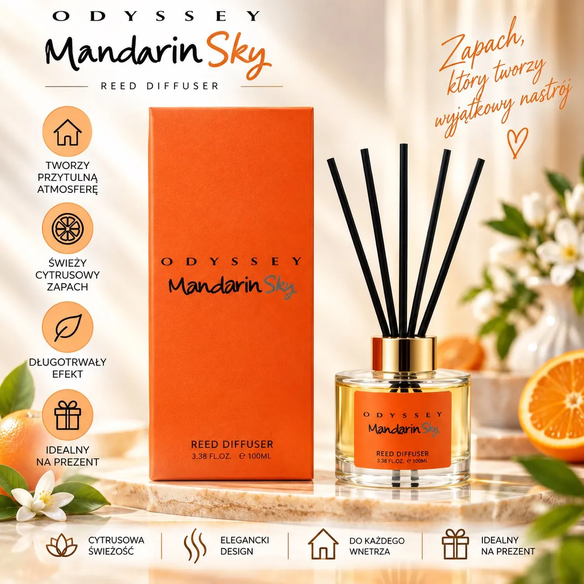 Perfumy z patyczkami Mandarin Sky w pomarańczowym opakowaniu i szklanej butelce z czarnymi patyczkami