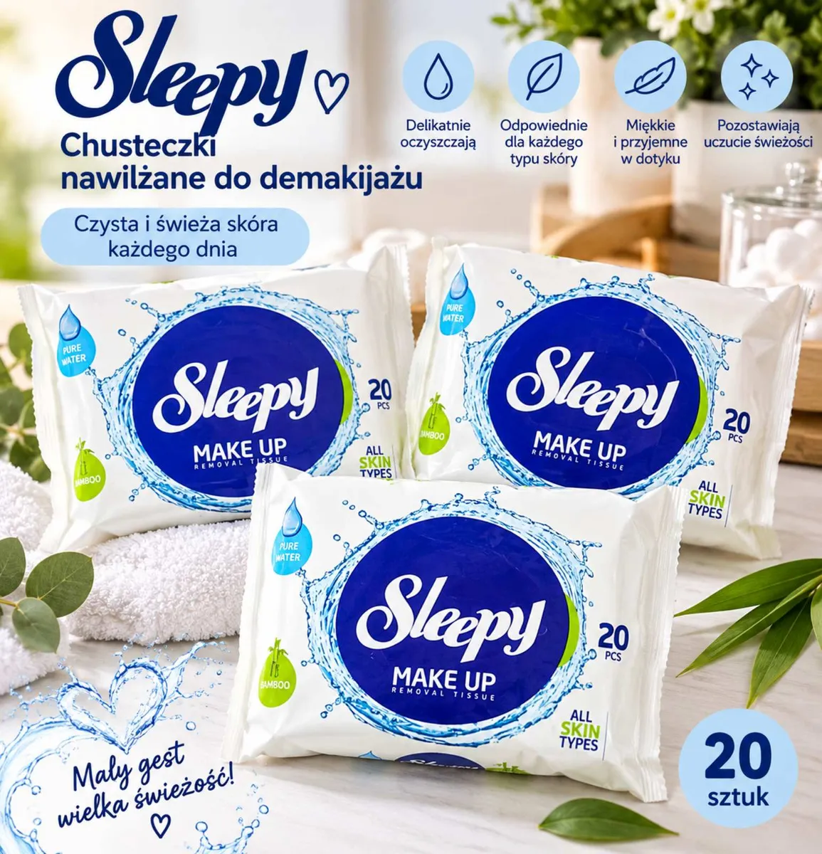 Trzy opakowania białych chusteczek nawilżanych Sleepy do demakijażu na jasnym tle z roślinami