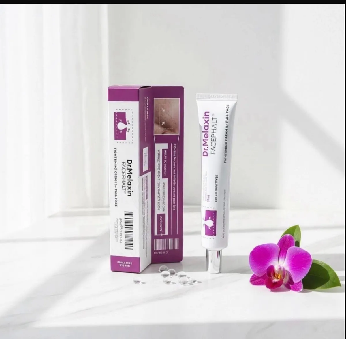 Krem do twarzy Dr. Melaxin Facephalt 30 ml w białej tubce z fioletowo-białym kartonikiem i kwiatem orchidei